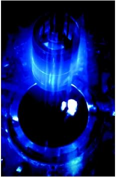 Image of Cerenkov radiation - Cherenkov radiation is produced when an electron travelling in a medium (e.g. in water) travels faster than the speed of light in that medium (which is not physically impossible, since the speed of light in any medium is always slower than in vacuum). This is somewhat analogous to breaking the sound barrier.